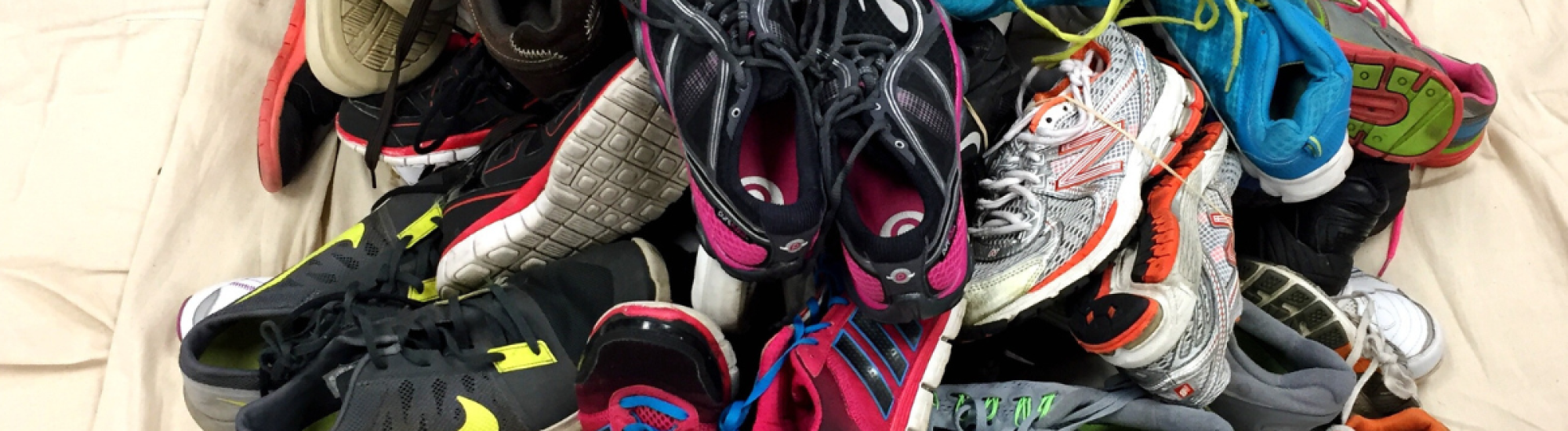 Pile of used sneakers for the Sneakers4Good program at UVAC