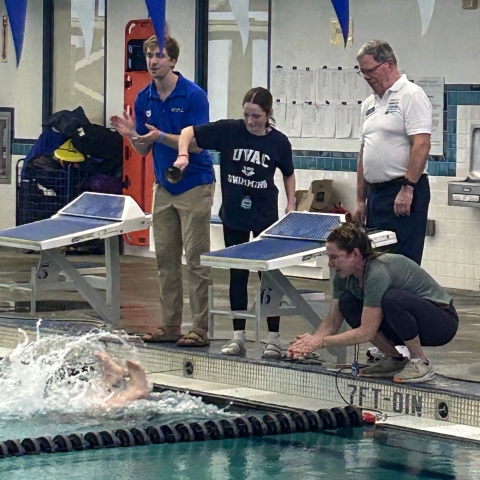 UVAC Swimmer Estelle Kipp being cheered on at the 2025 10 And Under Championship Meet